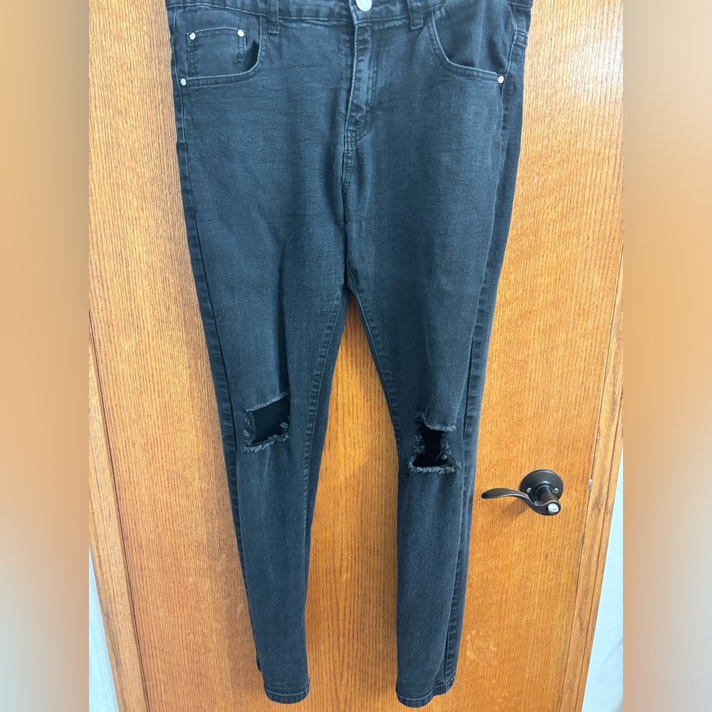 Dark black ripped jeans